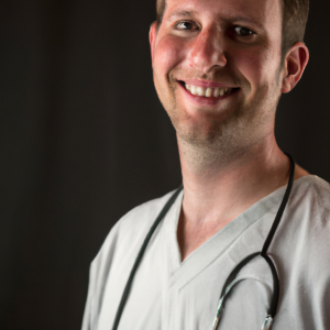 a professional and visually appealing image of a young happy smiling caucasian doctor with white teeth