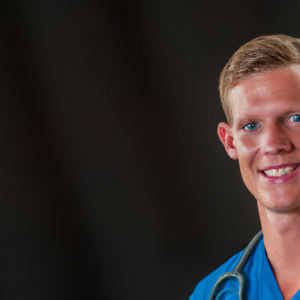 a professional and visually appealing image of a young happy smiling caucasian doctor with white teeth