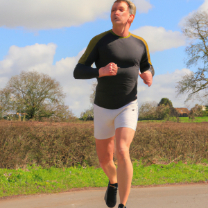 a professional appealing image of a caucasian man or woman jogging on a sunny day