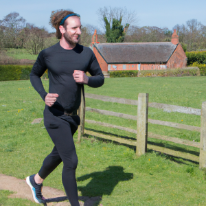 a professional appealing image of a caucasian man or woman jogging on a sunny day