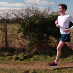 a professional appealing image of a caucasian man or woman jogging on a sunny day