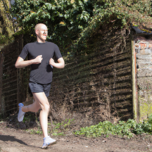 a professional appealing image of a caucasian man or woman jogging on a sunny day