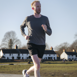 a professional appealing image of a caucasian man or woman jogging on a sunny day 657 300x300