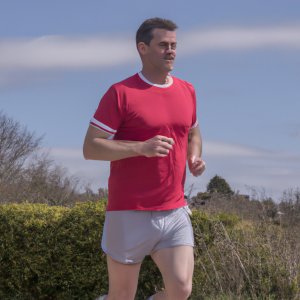 a professional appealing image of a caucasian man or woman jogging on a sunny day