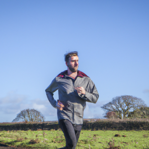 a professional appealing image of a caucasian man or woman jogging on a sunny day