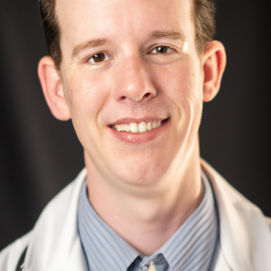 a professional and visually appealing image of a young happy smiling caucasian doctor with white teeth