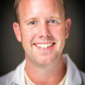 a professional and visually appealing image of a young happy smiling caucasian doctor with white teeth