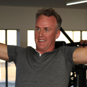 a professional appealing good looking and atheletic image of a caucasian man exercising in a gym