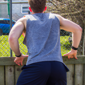 a professional appealing good looking and atheletic image of a caucasian man exercising or playing sports outside on a sunny day