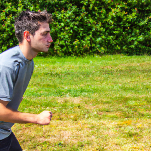 a professional appealing good looking and atheletic image of a caucasian man exercising or playing sports outside on a sunny day