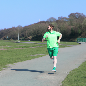 a professional appealing image of a caucasian man or woman jogging on a sunny day